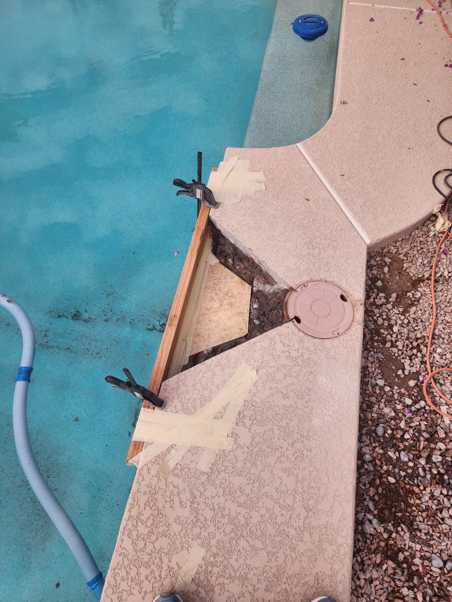 Excavated concrete around the pool skimmer